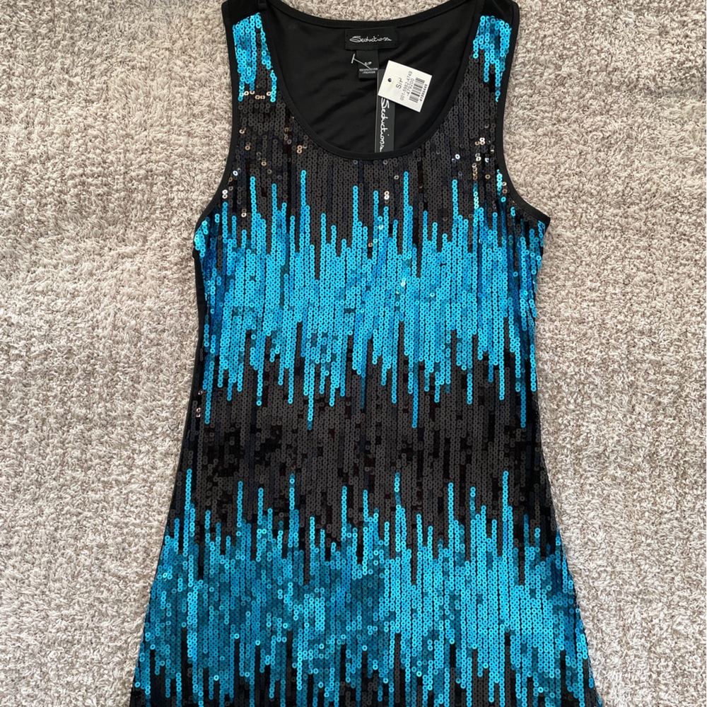 Beautiful sequin blue long top. Perfect over tights for a night out